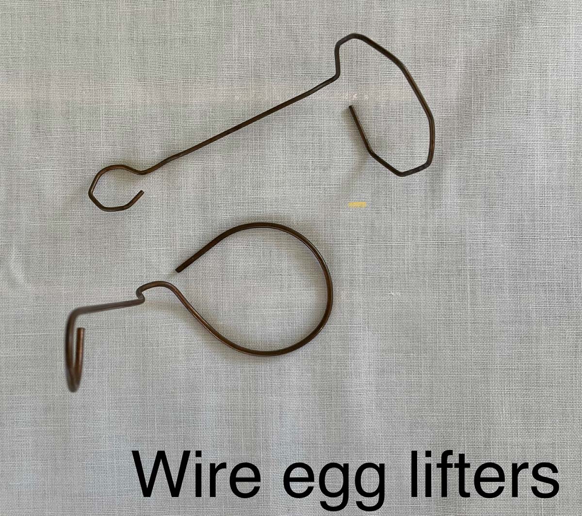 Homemade wire egg lifters for dying Easter eggs